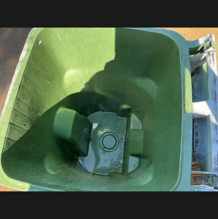 Green recycling bin interior after Hydro Hustle cleaned, sanitized, and deodorized it