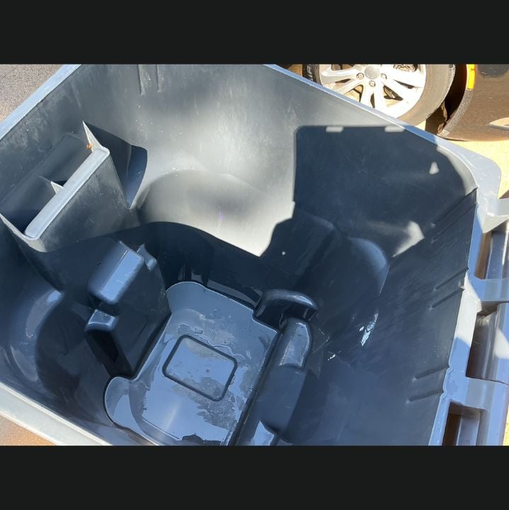 Clean gray interior of a residential trash bin after Hydro Hustle pressure washed and sanitized it in Arlington, Texas