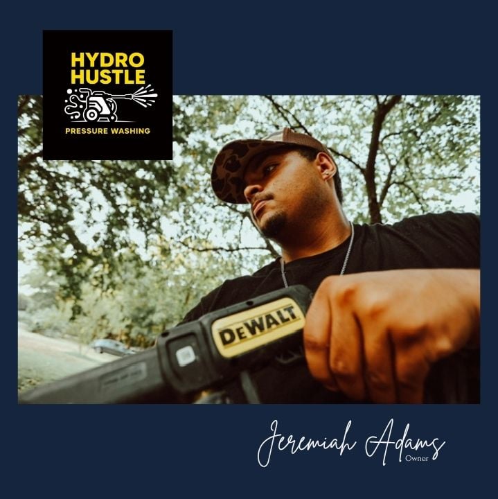 Jeremiah Adams, owner of Hydro Hustle Pressure Washing in Arlington, Texas, holding pressure washing equipment