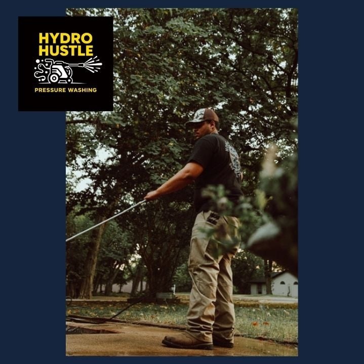Jeremiah Adams of Hydro Hustle pressure washing a concrete driveway in Arlington, Texas